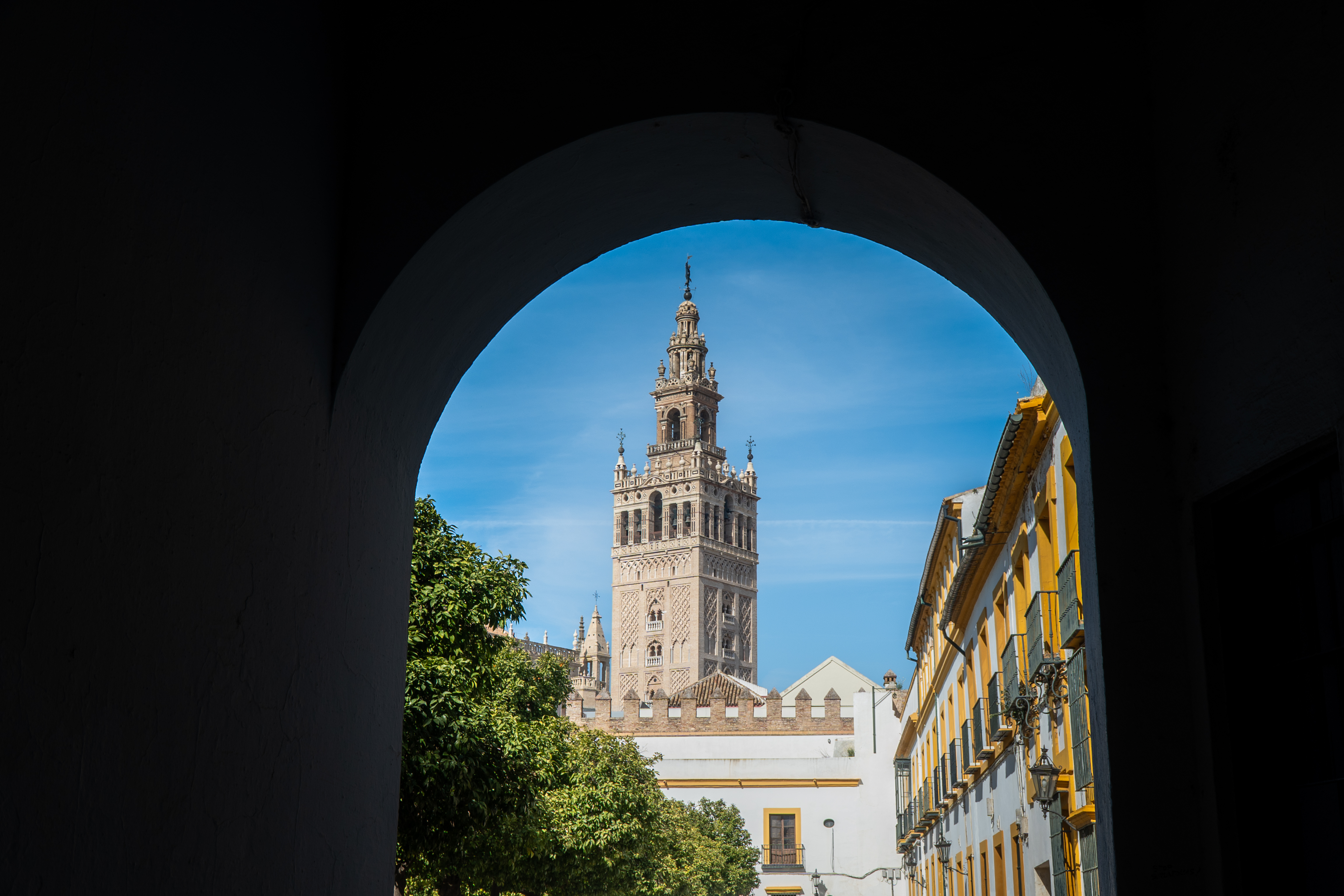 The Giralda seen through a shaded archway